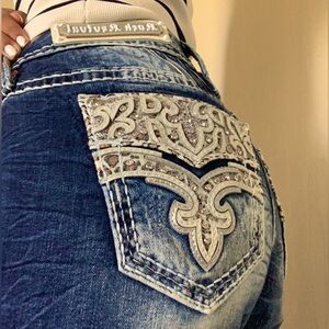 Rock Revival Jeans. There long enough for people up to 5’9 and are a size 30